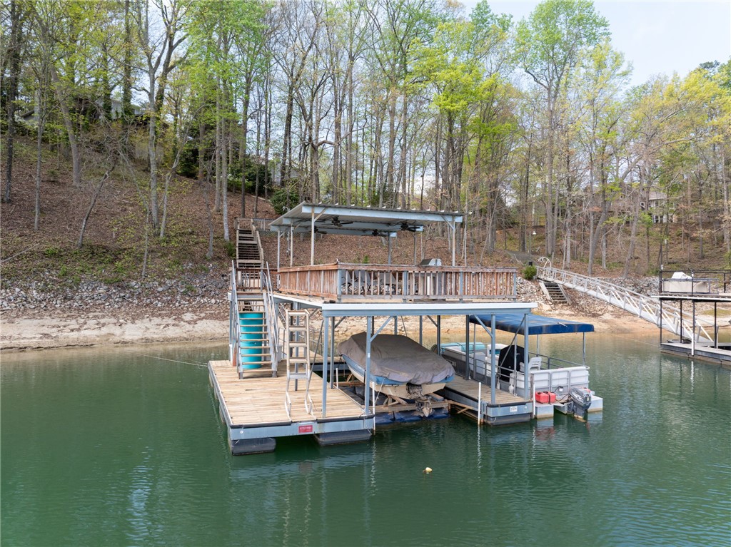 1002 Whitfield Point Road Anderson, SC 29626 - Photo 7 of 49 This scenic waterfront property offers direct lake access and a private boat dock, ideal for leisure.