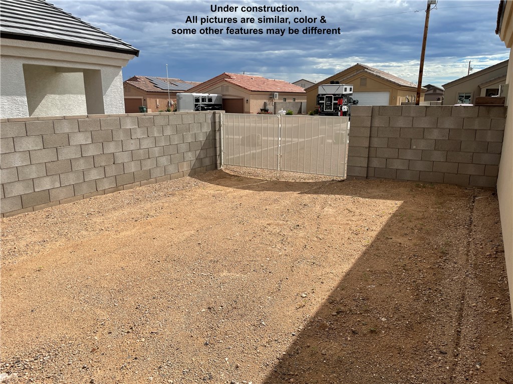 3591 North Verdugo Road Kingman, AZ 86409 - Photo 19 of 19 The property features a private outdoor area with a block wall perimeter and a gate