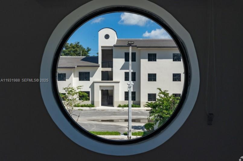2320 East 4th Avenue, Unit 102 Hialeah, FL 33013 - Photo 8 of 9 a view of swimming pool from a balcony