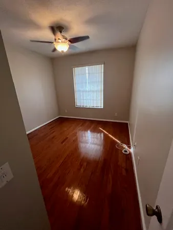a view of room with window and hardwood floor