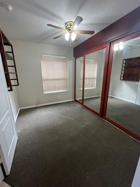 895 Northwest Sassafras Terrace Stuart, FL 34994 - Photo 14 of 23 an empty room with windows and fan