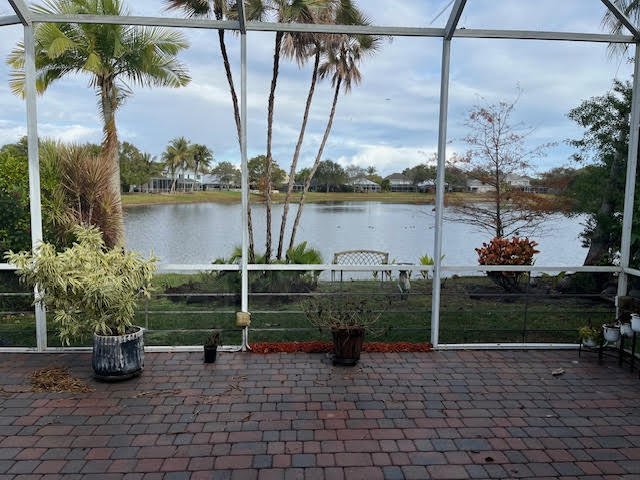895 Northwest Sassafras Terrace Stuart, FL 34994 - Photo 16 of 23 a view of a lake with a patio