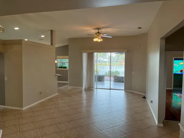 a view of hallway with a chandelier