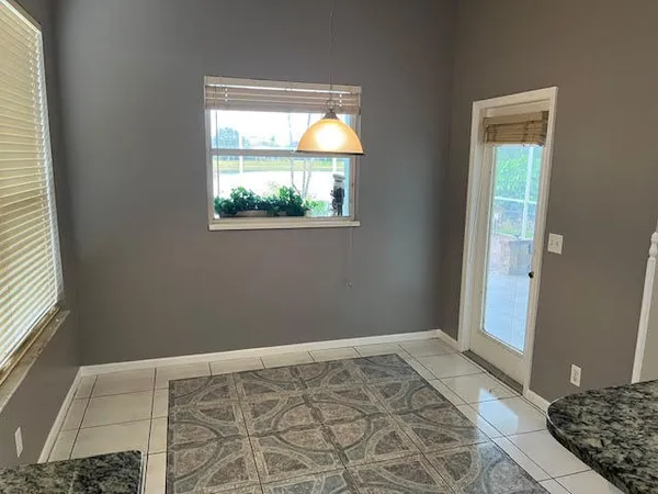 a view of an empty room and window