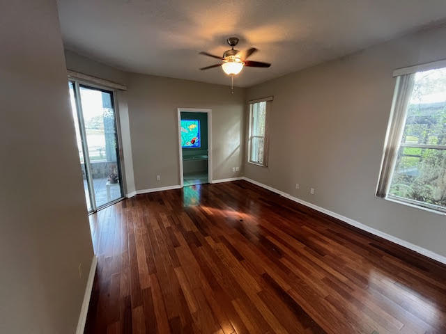 895 Northwest Sassafras Terrace Stuart, FL 34994 - Photo 9 of 23 wooden floor in an empty room with a window
