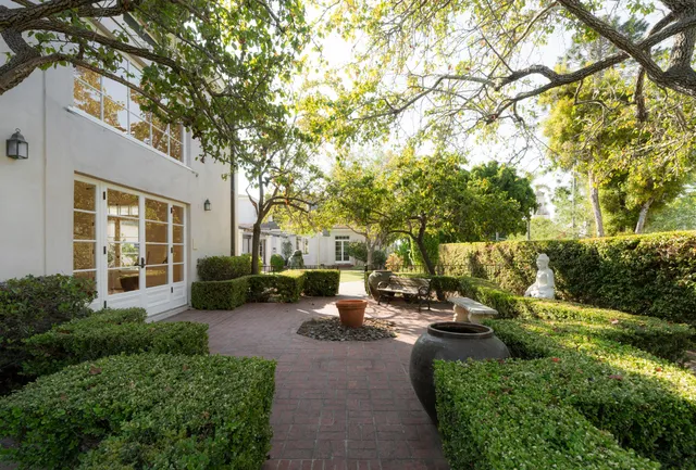 an aerial view of a house with outdoor space