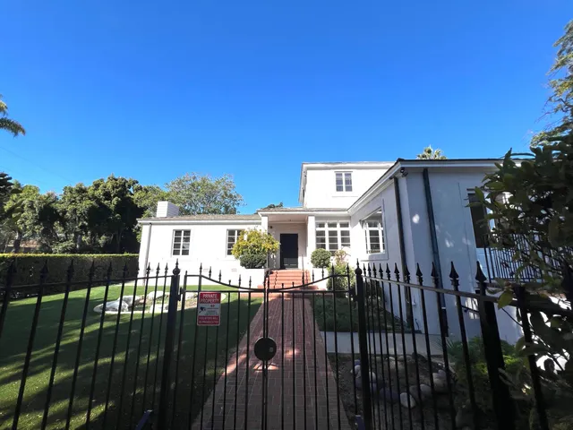 a front view of house with yard and outdoor seating