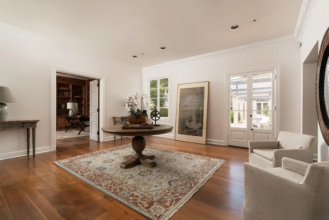 a living room with furniture a window and a fireplace