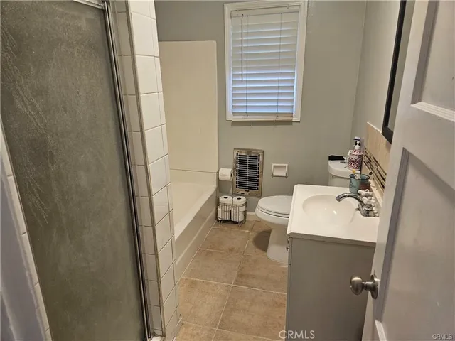 a bathroom with a sink a toilet and tub