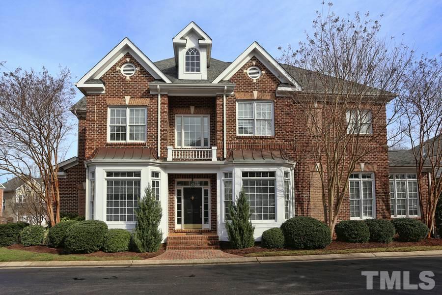 3109 Bentley Hill Road Raleigh, NC 27612 - Photo 1 of 25 a front view of a house with a yard