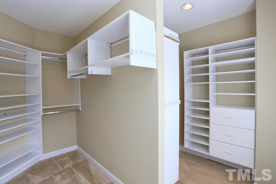 3109 Bentley Hill Road Raleigh, NC 27612 - Photo 15 of 25 a view of walk in closet with empty racks