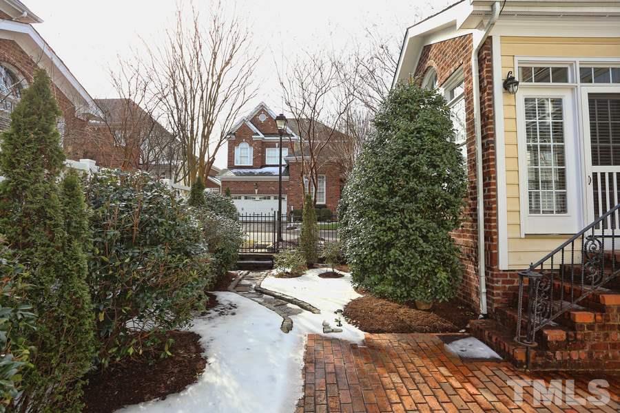 3109 Bentley Hill Road Raleigh, NC 27612 - Photo 20 of 25 a view of a house with a yard