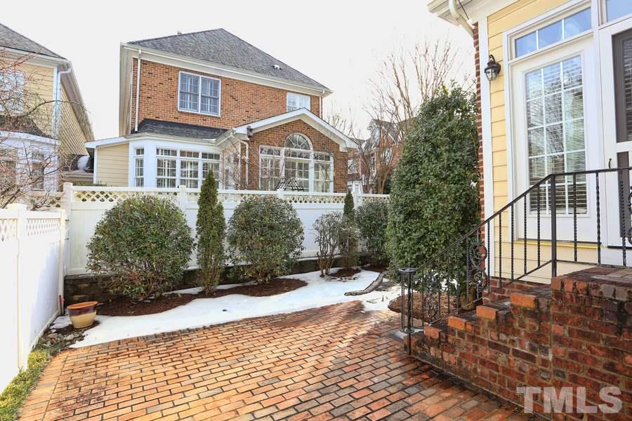 3109 Bentley Hill Road Raleigh, NC 27612 - Photo 21 of 25 a front view of a house with a yard