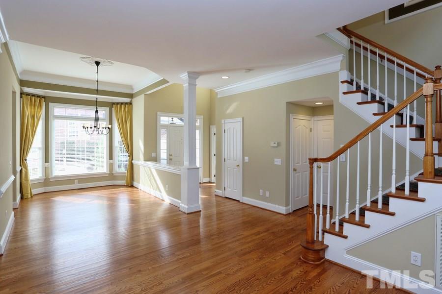3109 Bentley Hill Road Raleigh, NC 27612 - Photo 5 of 25 a view of an entryway with wooden floor and door