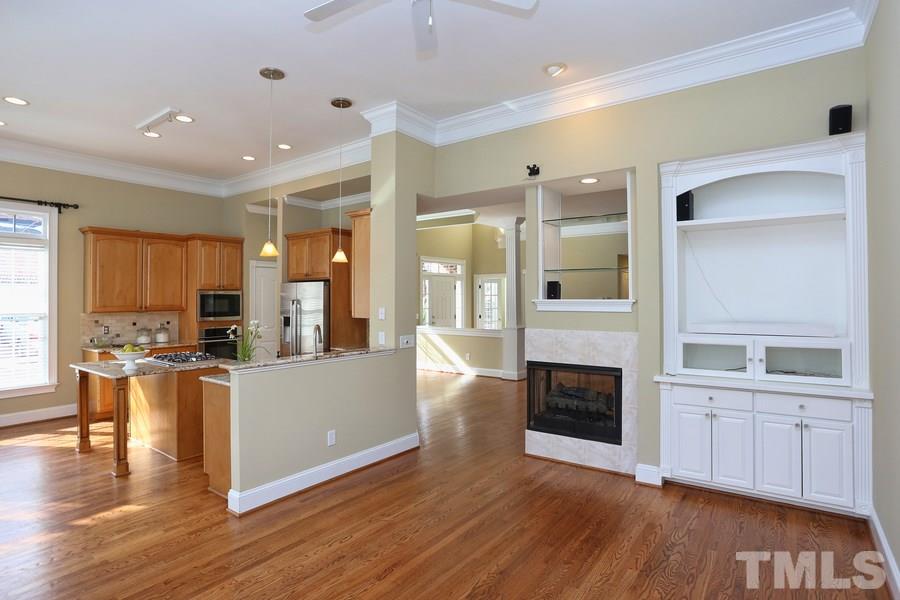 3109 Bentley Hill Road Raleigh, NC 27612 - Photo 8 of 25 a view of a kitchen with furniture and wooden floor