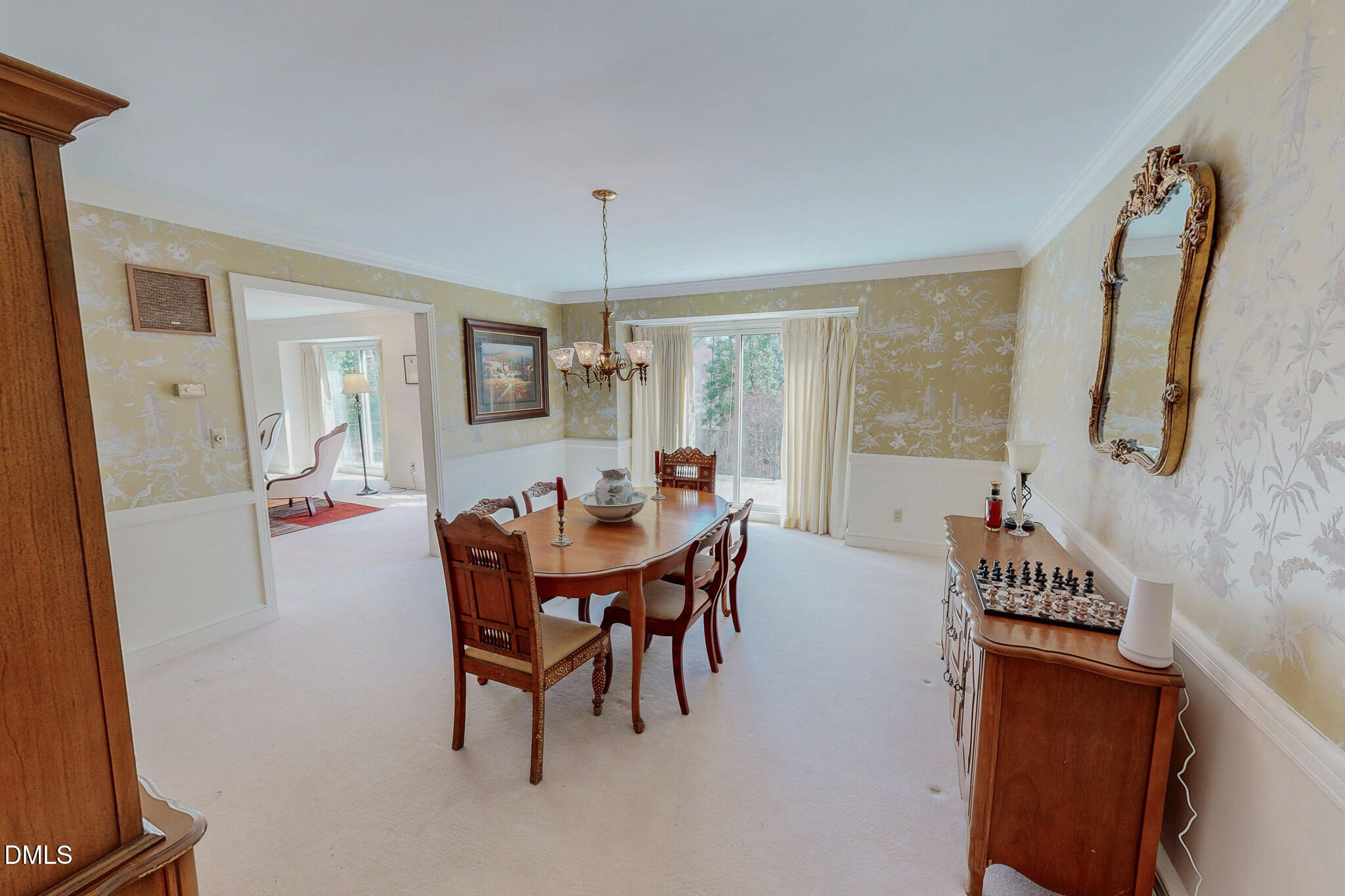 382 Wimbledon Drive Roxboro, NC 27573 - Photo 15 of 66 a view of a dining room with furniture and wooden floor
