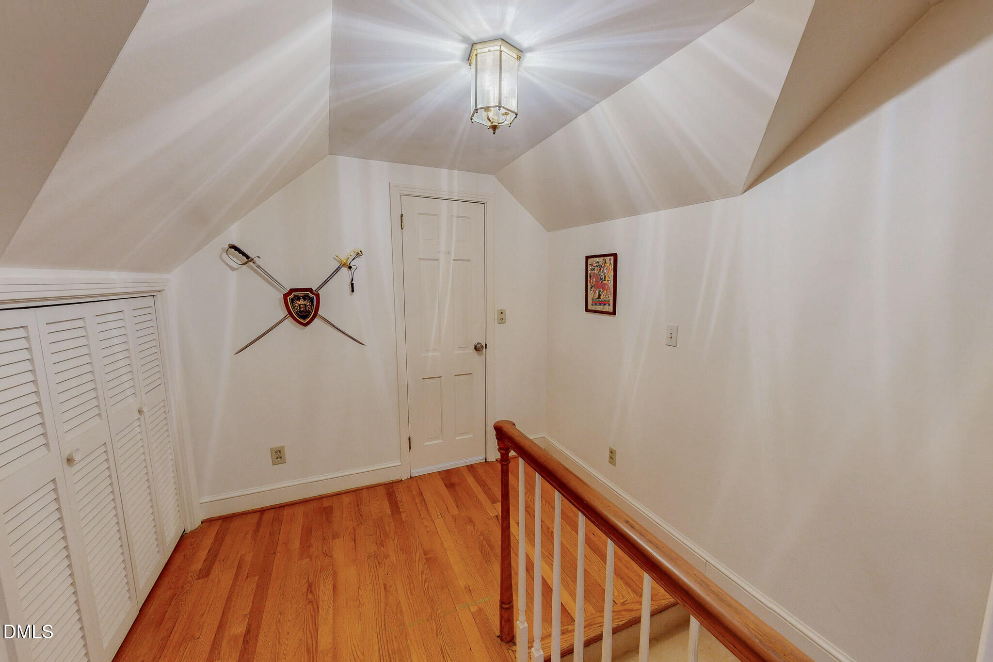 382 Wimbledon Drive Roxboro, NC 27573 - Photo 35 of 66 a view of a hallway with a white walls and chandelier