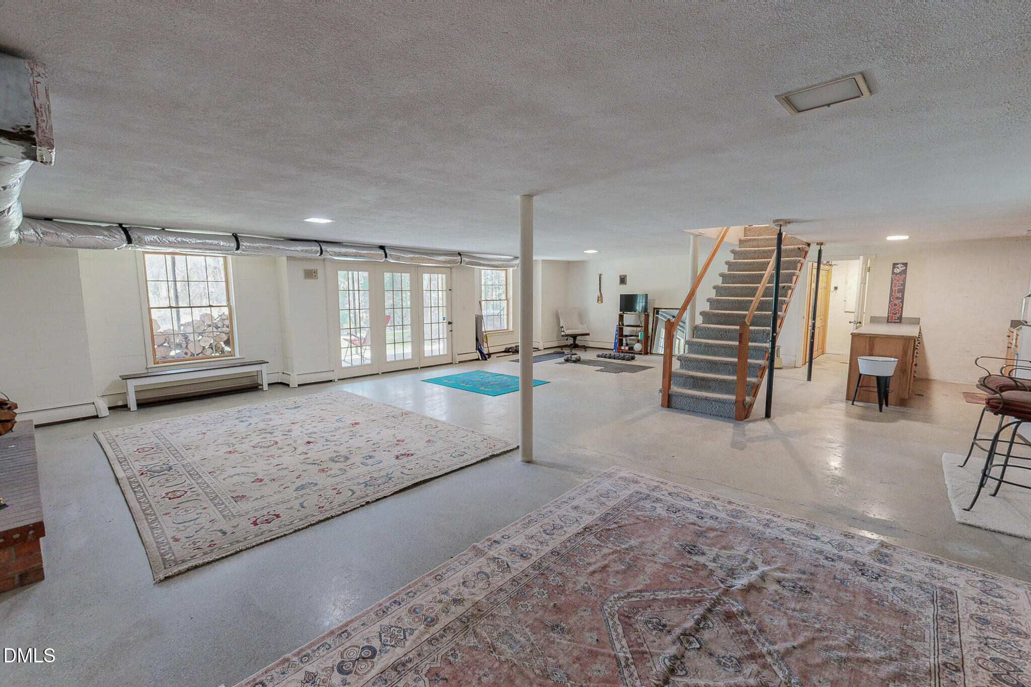 382 Wimbledon Drive Roxboro, NC 27573 - Photo 57 of 66 a view of a livingroom with furniture and a rug