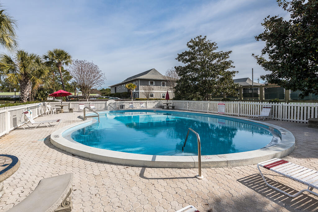 3799 East County Highway 30A, Unit C3 Santa Rosa Beach, FL 32459 - Photo 32 of 43 a swimming pool with yard and outdoor seating