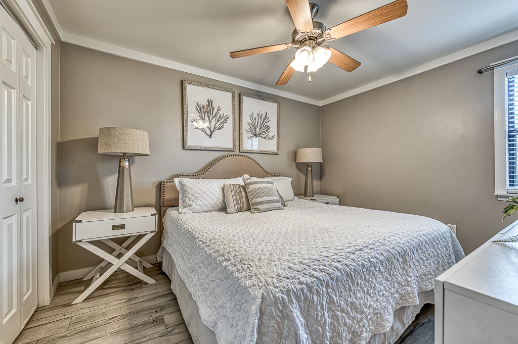 3799 East County Highway 30A, Unit C3 Santa Rosa Beach, FL 32459 - Photo 4 of 43 a bedroom with a bed and a chandelier