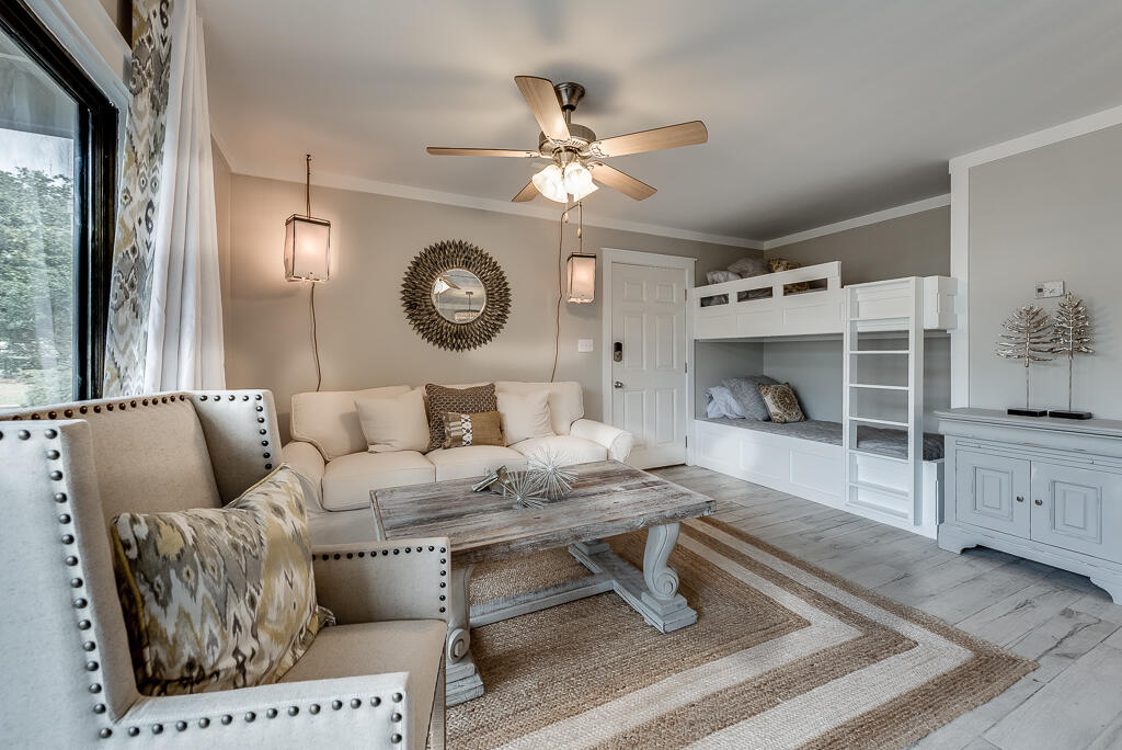 3799 East County Highway 30A, Unit C3 Santa Rosa Beach, FL 32459 - Photo 8 of 43 a living room with furniture a clock and a table
