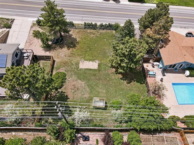 an aerial view of a house with yard
