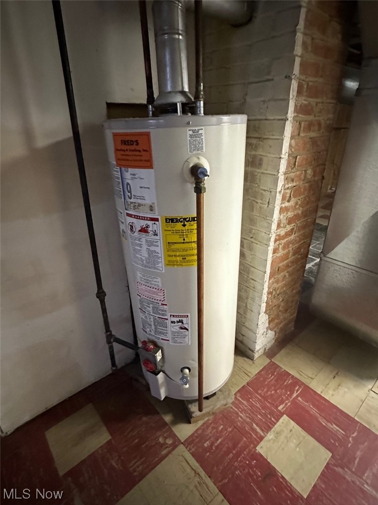 4994 North Barton Road Cleveland, OH 44124 - Photo 21 of 28 Utility room featuring water heater