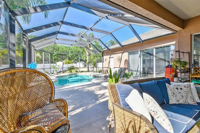 a view of a backyard with sitting area