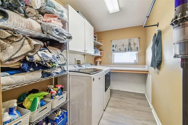 a view of a yard with wooden fence