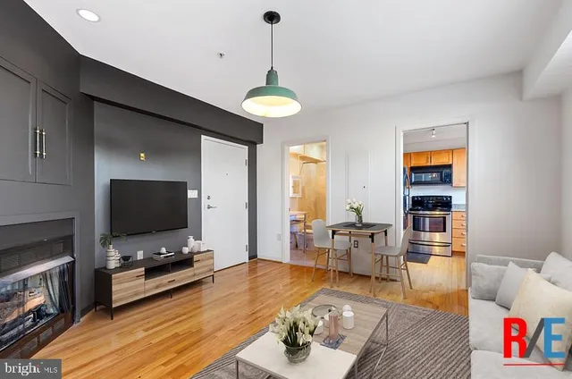 a living room with furniture and a flat screen tv