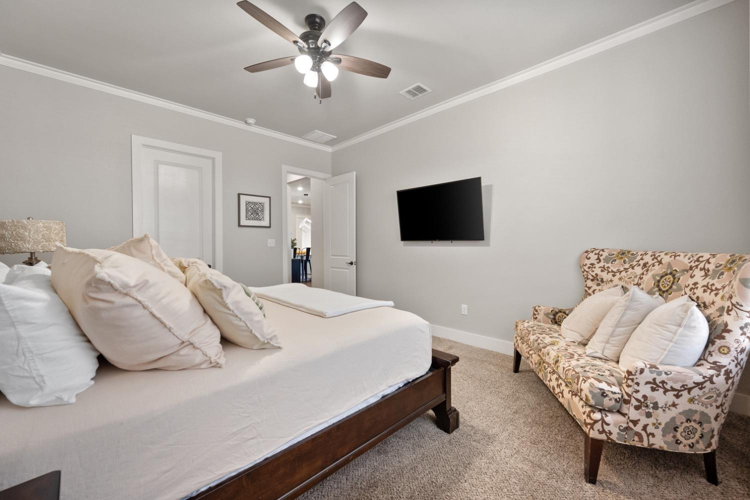 7805 52nd Street Lubbock, TX 79407 - Photo 20 of 32 a bedroom with bed and a flat screen tv