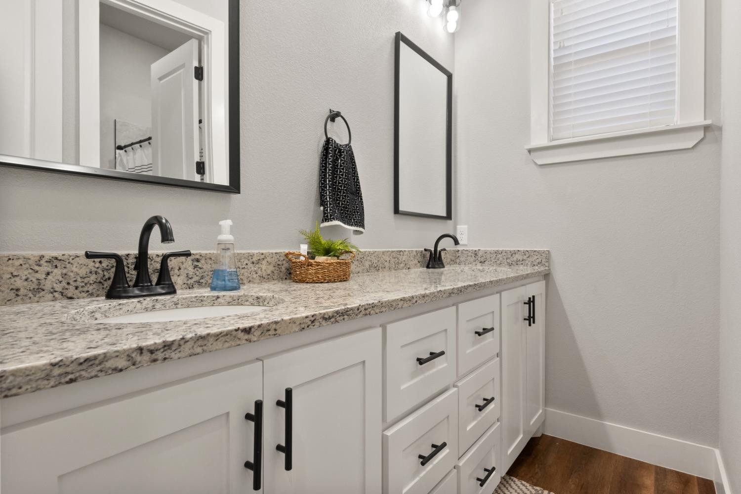 7805 52nd Street Lubbock, TX 79407 - Photo 25 of 32 a bathroom with sink and mirror