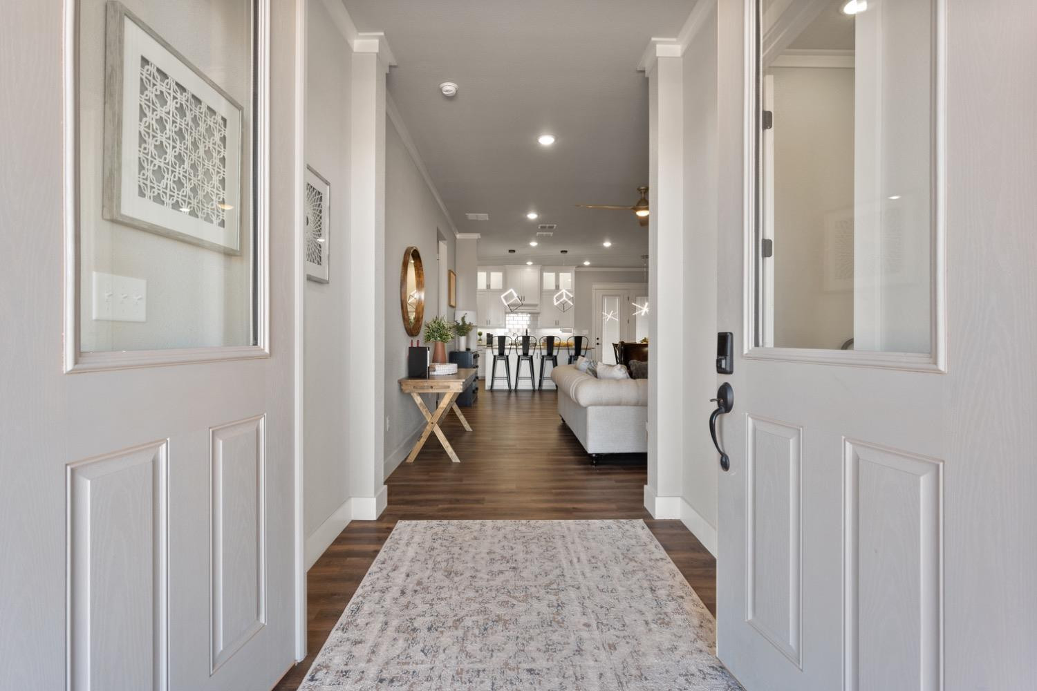 7805 52nd Street Lubbock, TX 79407 - Photo 4 of 32 a view of a hallway with a dining table and chairs