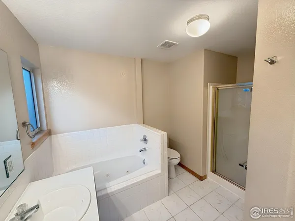 a bathroom with a bathtub toilet and sink