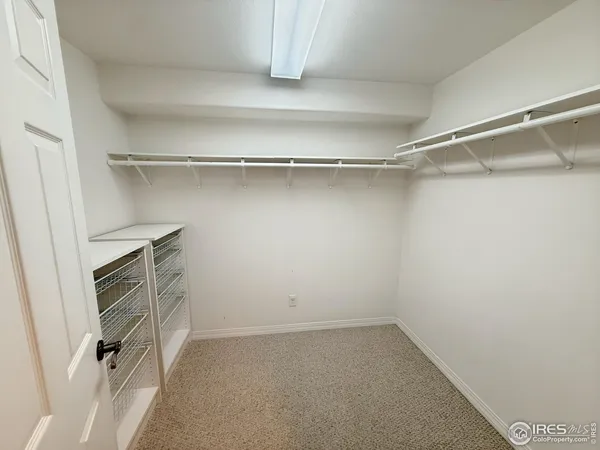 a bathroom with a sink a toilet a mirror and shower