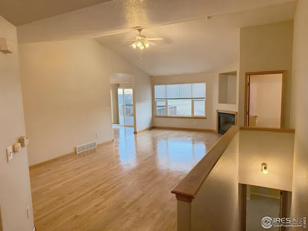 a view of a living room with hardwood floor
