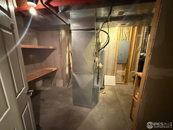 a view of an empty room and a window