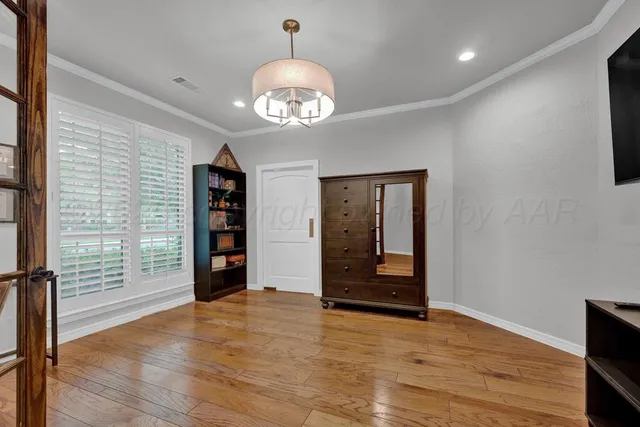 a view of a livingroom with furniture and a flat screen tv