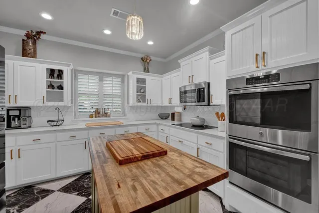 a view of a dining room with furniture and a large window