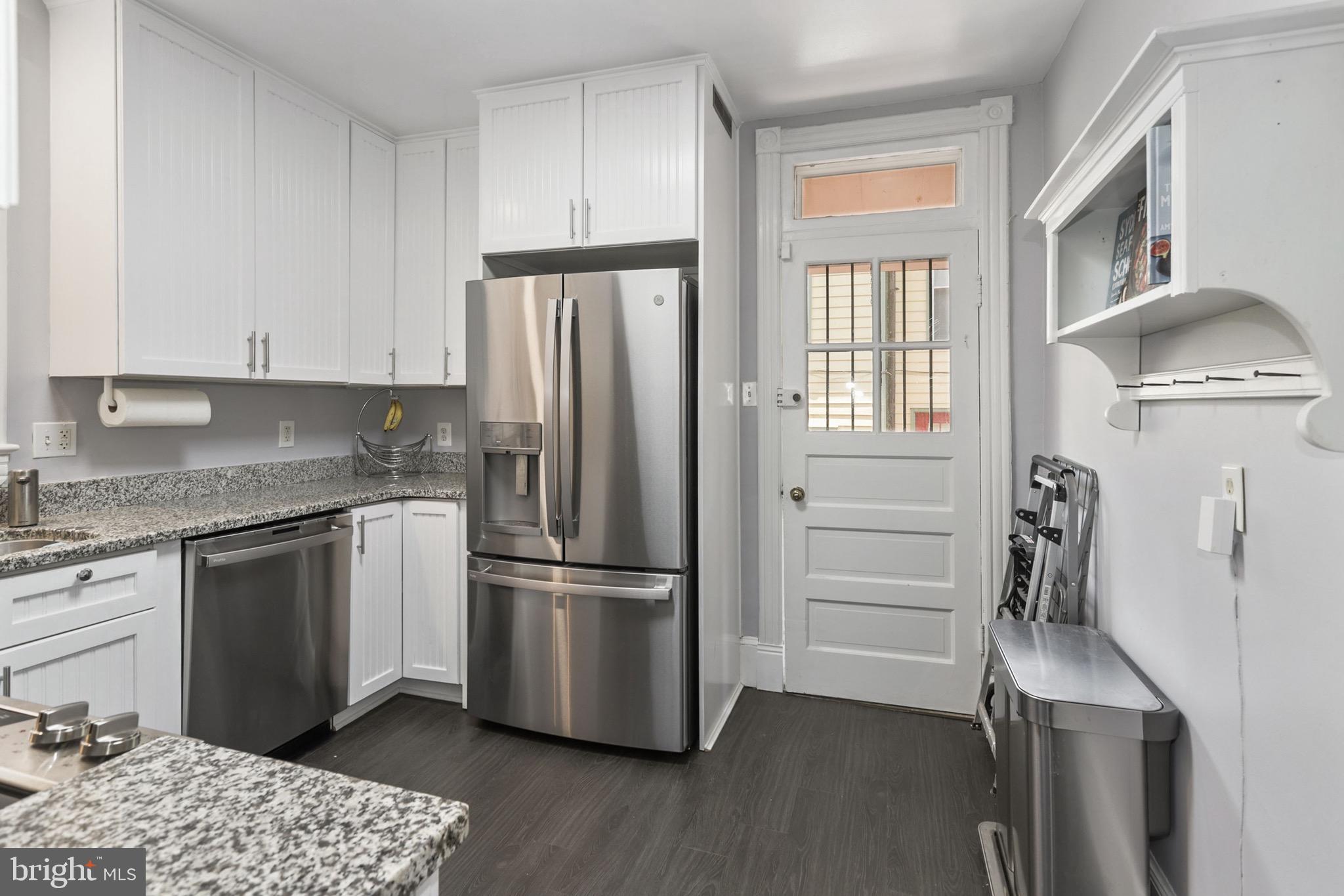 549 4th Street Southeast Washington, DC 20003 - Photo 11 of 33 Kitchen w/ Exit to Back Patio