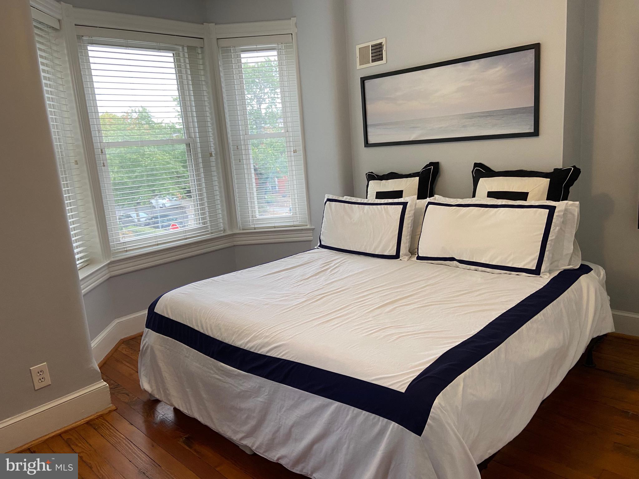 549 4th Street Southeast Washington, DC 20003 - Photo 13 of 33 Master Bedroom w/ Original Hardwood Floors