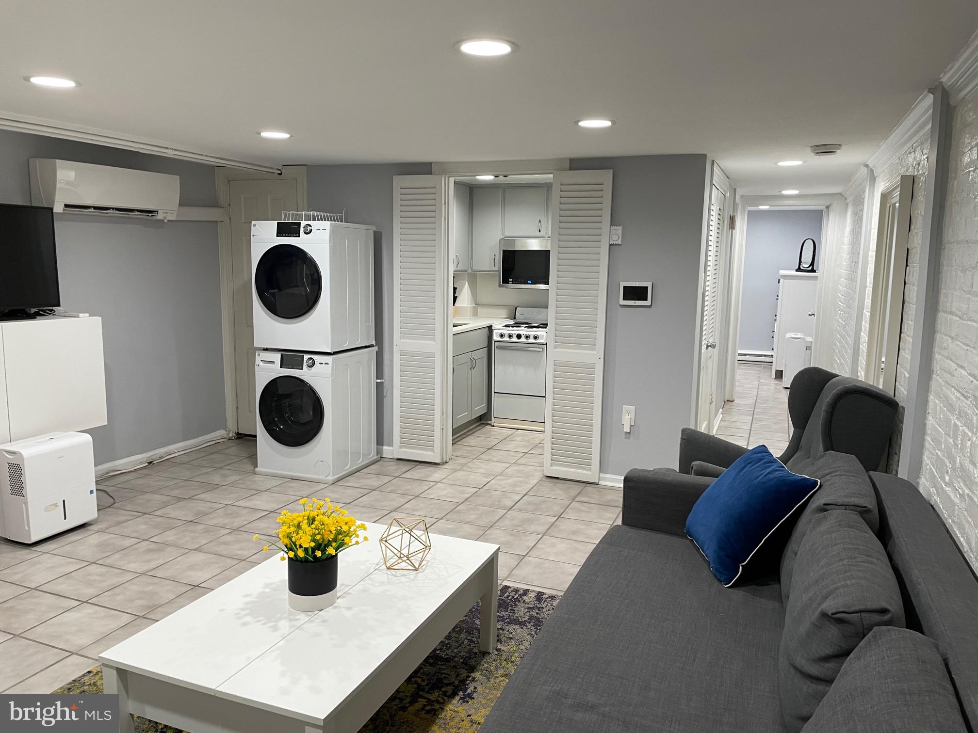 549 4th Street Southeast Washington, DC 20003 - Photo 25 of 33 Lower Level w/ Fireplace and Second Entrance/Exit