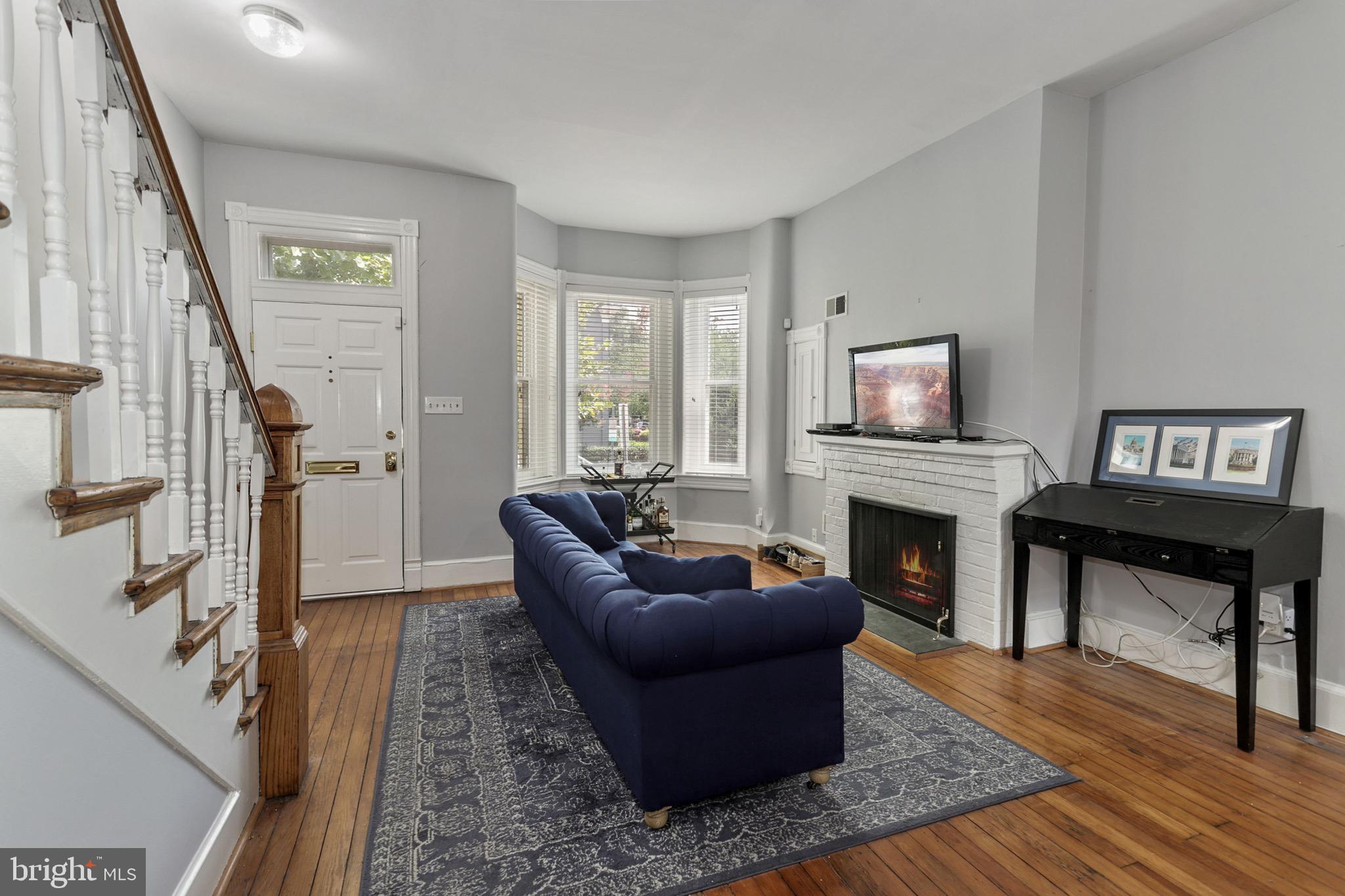 549 4th Street Southeast Washington, DC 20003 - Photo 3 of 33 Spacious Living Room w/ Wood Burning Fireplace