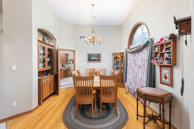 2658 East 1559th Road Ottawa, IL 61350 - Photo 20 of 53 a dining room with furniture a rug and wooden floor