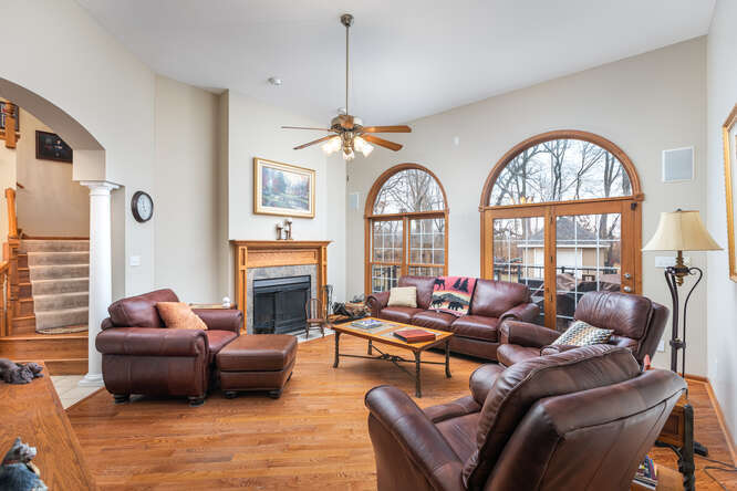 2658 East 1559th Road Ottawa, IL 61350 - Photo 22 of 53 a living room with furniture a fireplace and a large window