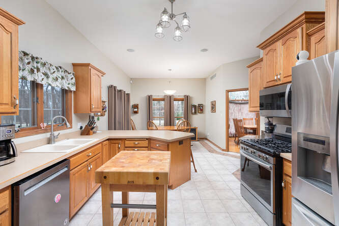 2658 East 1559th Road Ottawa, IL 61350 - Photo 25 of 53 a large kitchen with stainless steel appliances granite countertop a stove and a sink