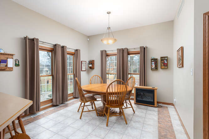 2658 East 1559th Road Ottawa, IL 61350 - Photo 26 of 53 a dining room with furniture a chandelier and window