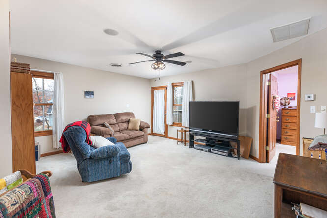 2658 East 1559th Road Ottawa, IL 61350 - Photo 38 of 53 a living room with furniture and a flat screen tv