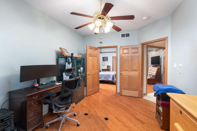 2658 East 1559th Road Ottawa, IL 61350 - Photo 39 of 53 a view of a workspace with furniture and a flat screen tv