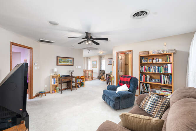 2658 East 1559th Road Ottawa, IL 61350 - Photo 40 of 53 a living room with furniture and a flat screen tv